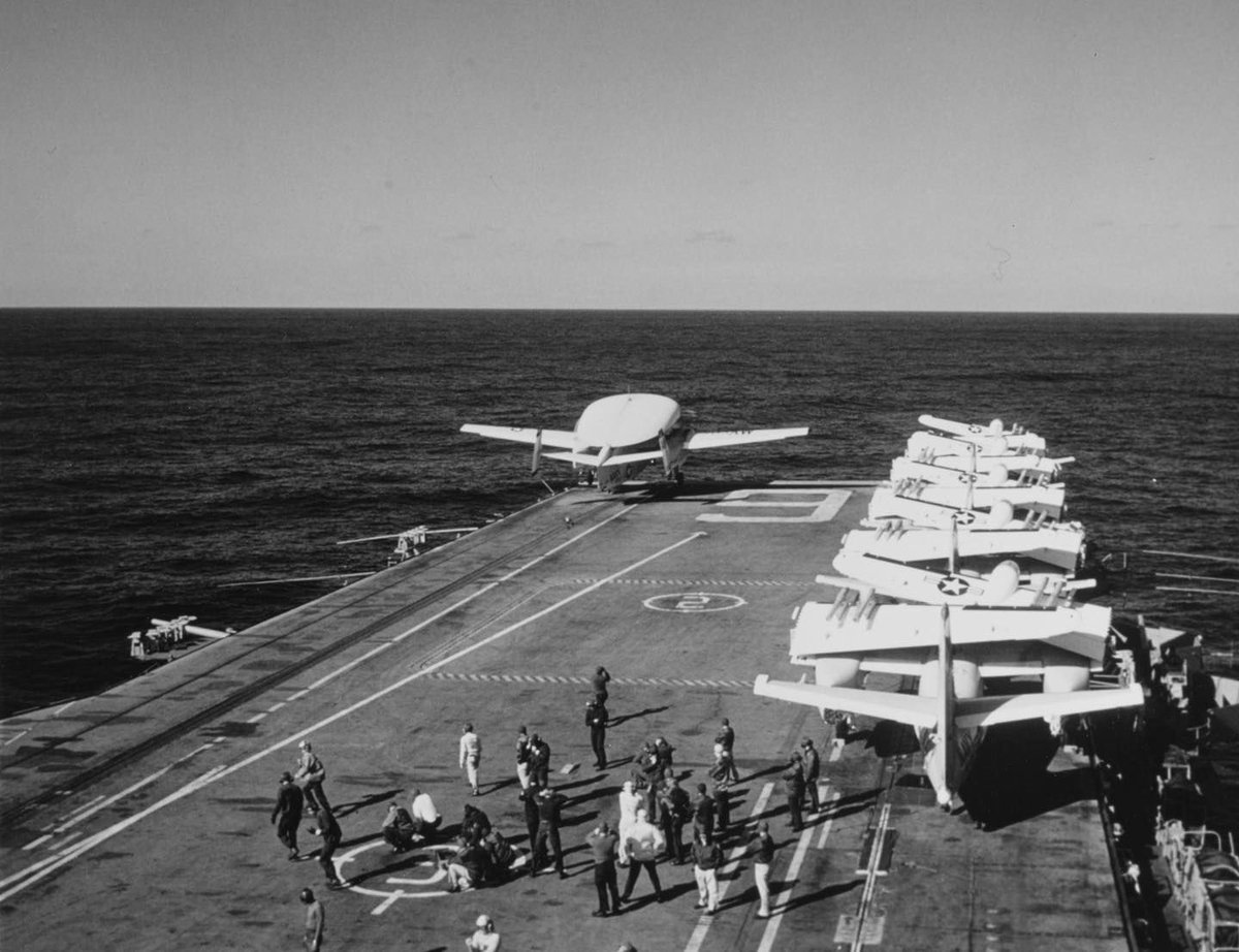 USS Essex CVS-9 an E-1B Tracer leaves the carrier's port catapult, during flight operations at sea in November 1967. Five S-2 Tracker anti-submarine aircraft are parked on the flight deck's starboard side. #ussessex #cvs9 #cv9 #e1b #e1btracer #s2tracker #flynavy #aviationsafari