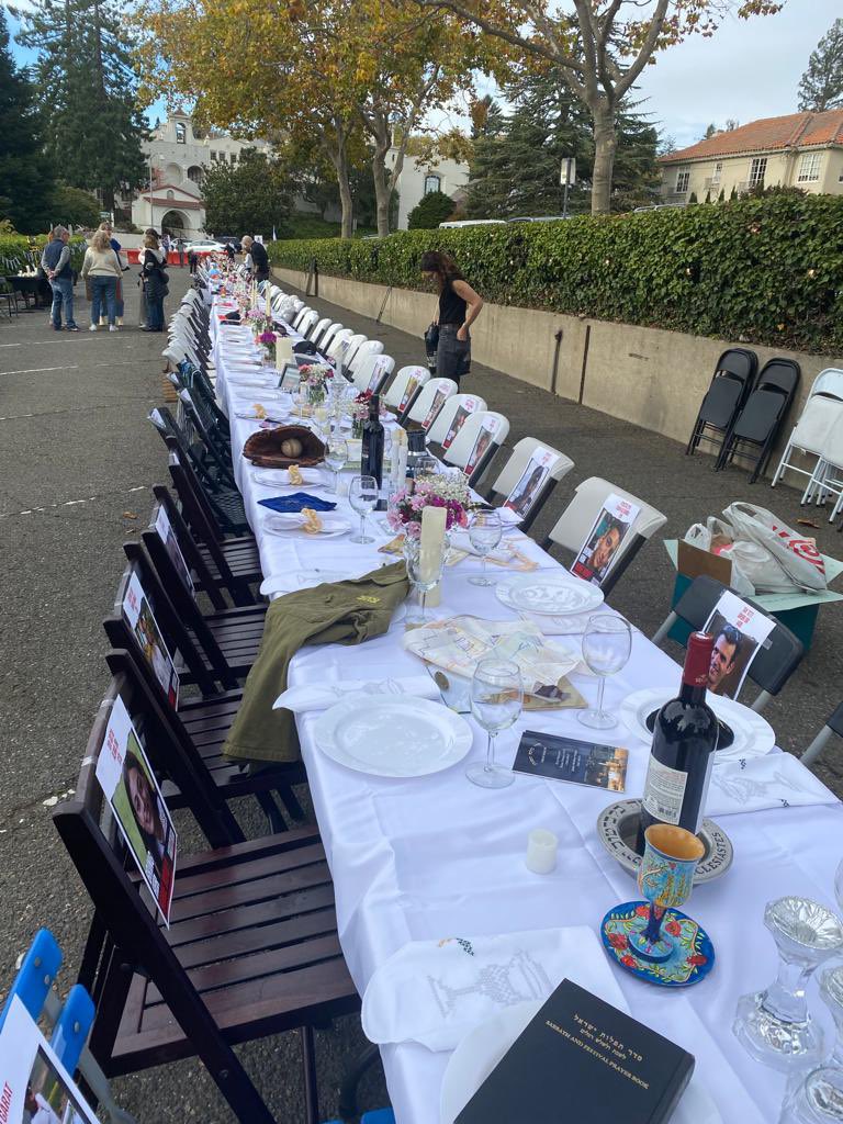 Wow: empty Shabbat table set up in Piedmont, with one empty seat for each of the hostages held by Hamas. Quite powerful. And, thankfully, peaceful.