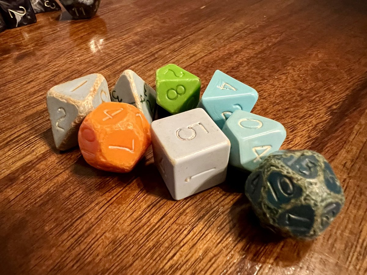 Played some #TTRPG with my kiddo today after she found my set of dice from the 80’s that I used to play 2nd Edition Advanced Dungeons &amp; Dragons. The 20 sided die is almost spherical the edges have worn down so much.
