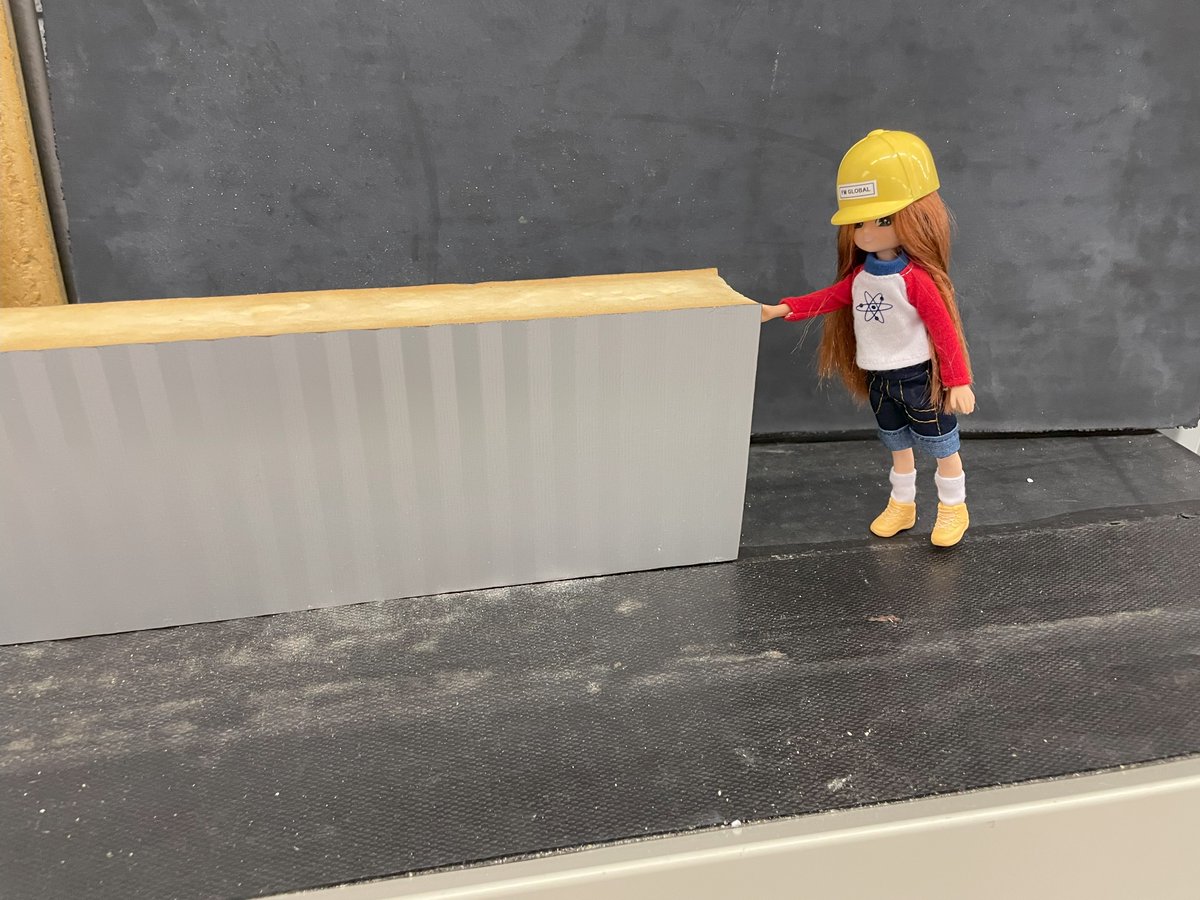 Lottie is in the #FMGlobal Learning Center for #weslottietour. Lottie knows that some building materials burn worse than others, so she’s checking out a foam insulated metal panel – have FM Approvals tested this one and it won’t contribute to a fire Lottie? <a href="/wes1919/">Women's Eng. Society</a> #TEWeek23