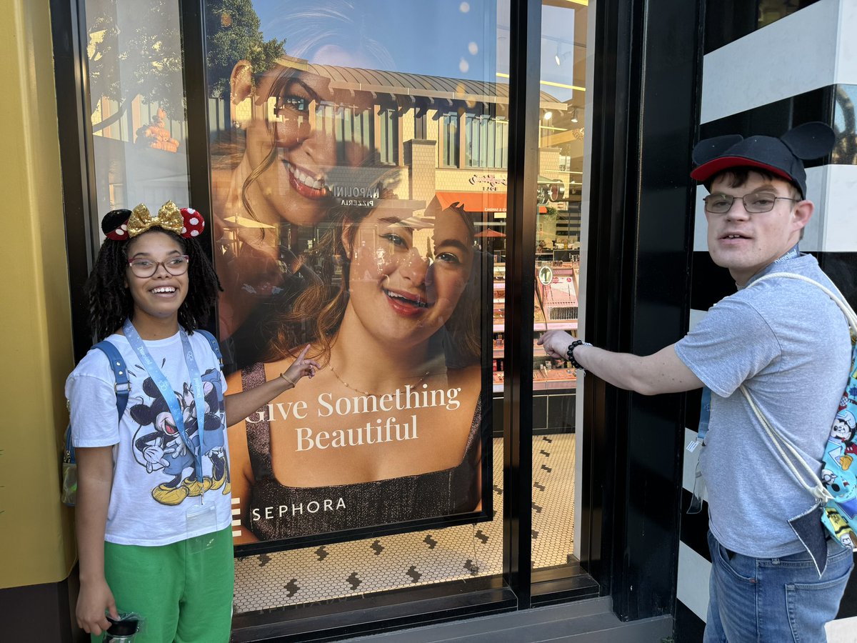 SenSaraGelser's tweet photo. These two roommates noticed this beautiful ad outside of a Sephora at Downtown Disney. Representation matters! #DisabilityTwitter #SeeDisability #DisabilityPride https://t.co/R5Yw8ZEjlz