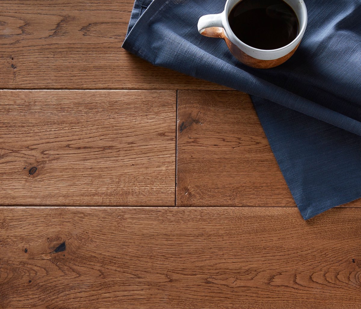 The dark caramel colour of Hatfield Oak creates an earthy natural look in any room. The handscraped finish and natural grade give this flooring bundles of character.

#Flooring #Doors #NorthEast