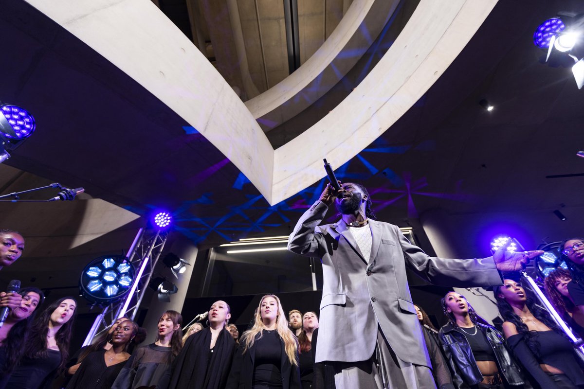 Last week, members of NewYVC shared the stage with the one and only @kojeyradical for the launch of the new @lcflondon_ building in Stratford! Singing alongside @udmusicldn , @Flames_VC , @singtowerham and Filament Choir 📸 Eilwen Jones/David Parry