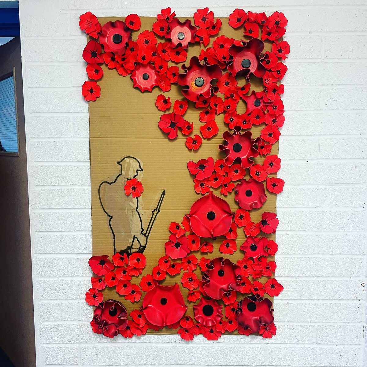 SamBP2's tweet image. Staff and students of @voyagelearning made vinyl and paper poppies for Remembrance Day.