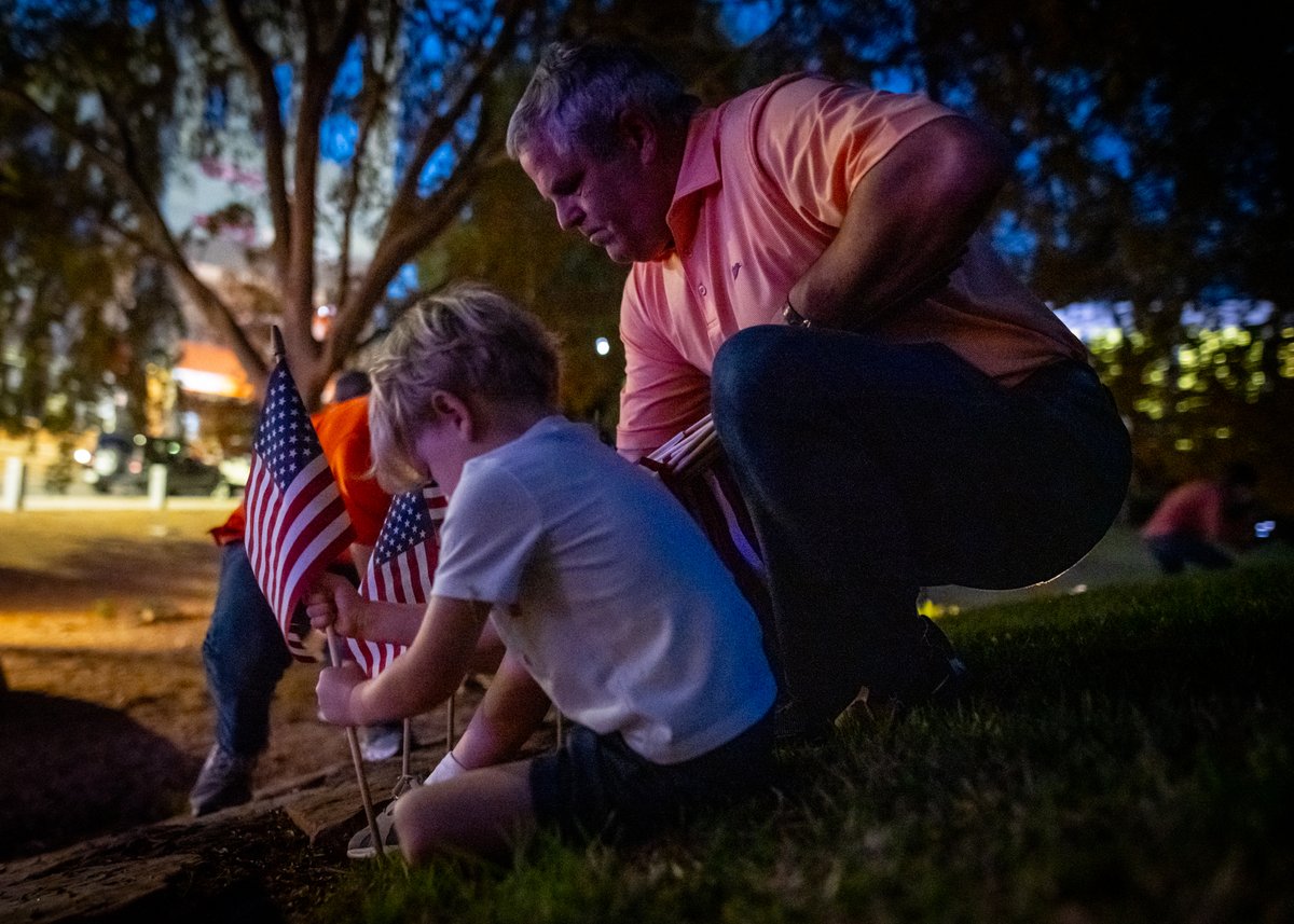 kenscar1's tweet photo. More than 100 people showed up last night to place flags around the Scroll of Honor for Veterans Day. Flags ringed the Scroll in record time, even in the dark! #VeteransDay2023 https://t.co/ZFv0Ls1U4B