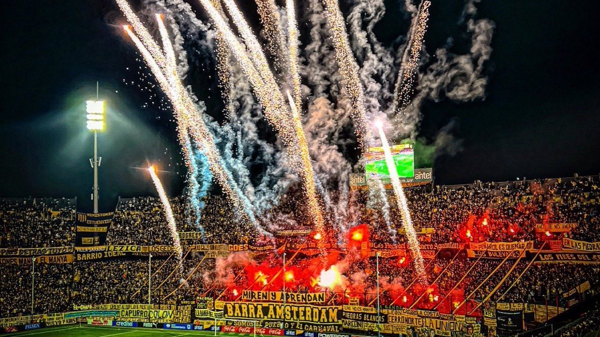 Mosaicos y la pelotudez de los billetes.
Son hinchas europeos, igual de amargos, por eso la fiesta y el pueblo están de este lado y no del suyo.

Peñarol es pueblo y carnaval.