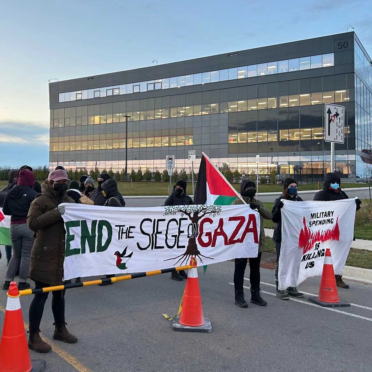 PalestineLabour's tweet photo. 4 weapons manufacturing plants shut down right now! 

Hundreds of workers &amp; community members shut down L3Harris in plants in Hamilton, Toronto &amp; Montreal, and Lockheed Martin in Ottawa. 

#ShutItDown4Palestine #CeasefireNOW https://t.co/qWiDmNlAbv