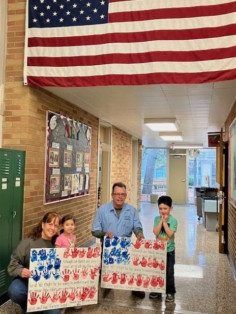 ParmaSchools's tweet image. A First Step Preschool class created an American Flag made of their tiny handprints. They made this flag in honor of our very own Veterans which we have on our First Step Staff, Cpl Darla Strickler USMC and Third Class Navy Petty Officer Edward Green.  Thank you veterans! #PCSD