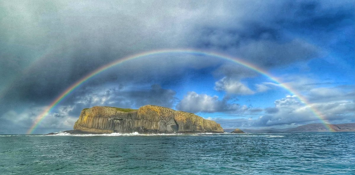 Passing Staffa today just as this rainbow formed above the island. A big swell and waves breaking over the walkway made for a spectacular sight #Mull