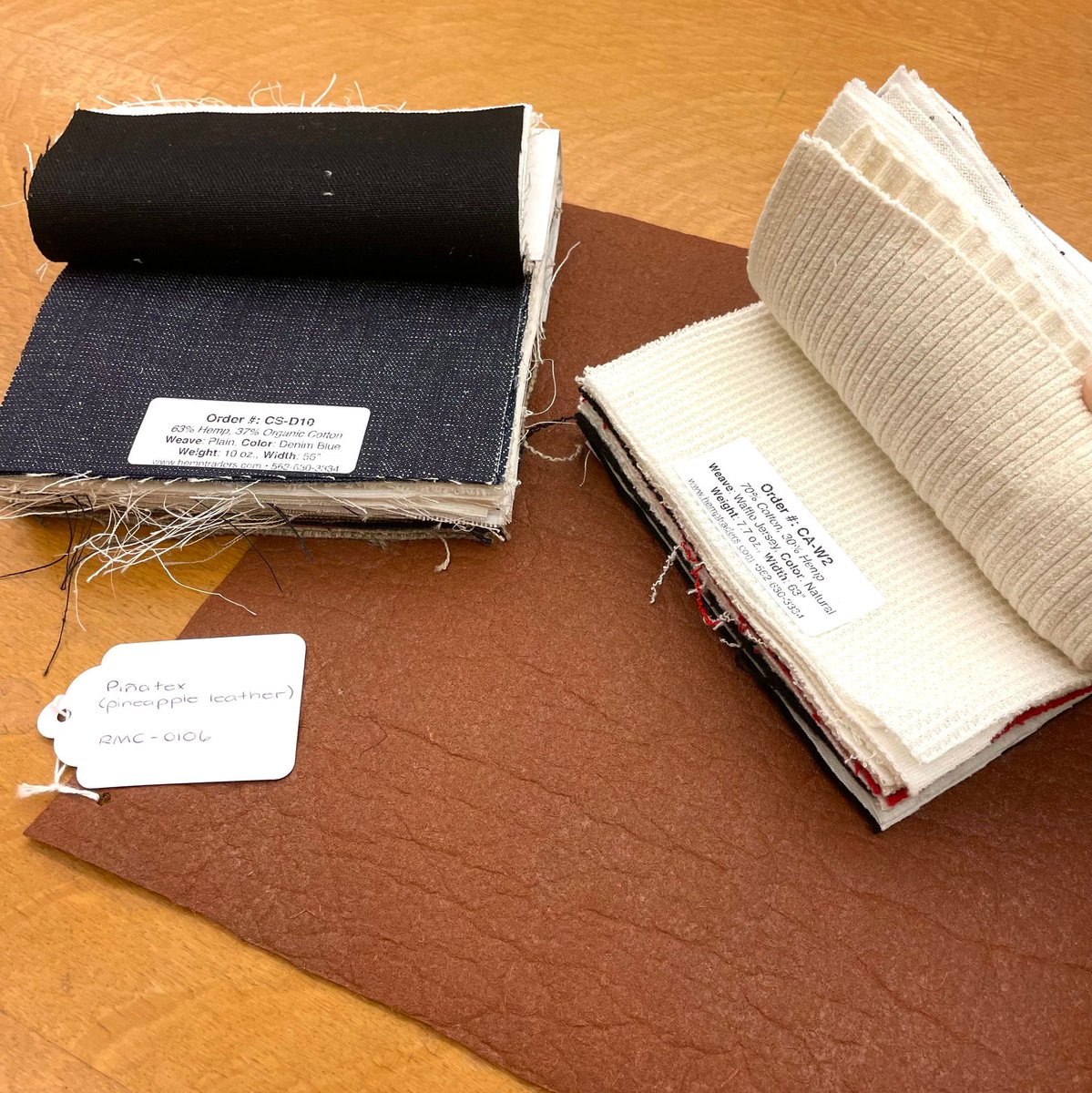 RickerLibraryUI's tweet image. Friday is for #MaterialsLibrary highlights now! Featuring in our textile collection is the handy hemp fiber sample book, Hemp Traders Fabric Swatch Book, and the cool alternative leather made from pineapple wastes, #Piñatex. Free to touch and feel and only at the Ricker Library😎