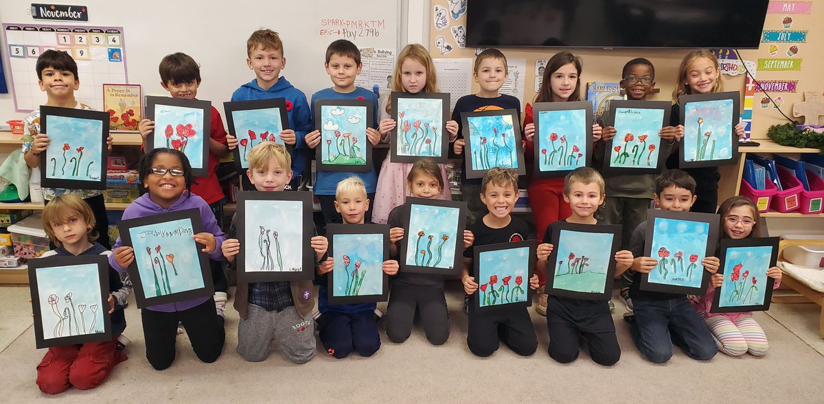 The poppies we drew for Remembrance Day! We read A Poppy Is to Remember by Heather Patterson and each student came up with one word or phrase that the poppy symbolized to them and wrote it on their page. Bella and Noah got to bring up our classroom wreath today.