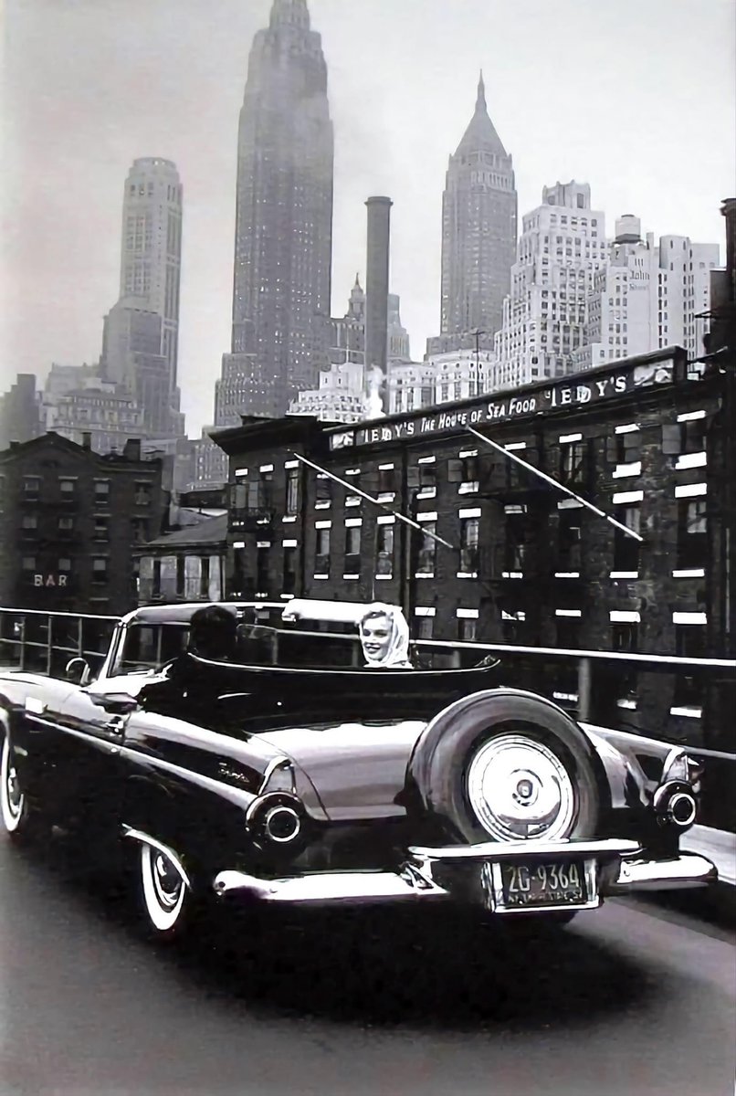 Marilyn Monroe and her husband Arthur Miller, driving through Manhattan in Marilyn's 1956 Ford Thunderbird.