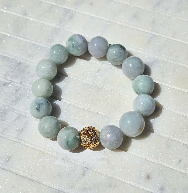 Beautiful Jade bracelet. Find this and many other options in our shop! #jade #jadebracelet #13mm #silvercharm #fashion #womensbracelet #fashionbracelet #naturalstones #crystals #smallbusiness