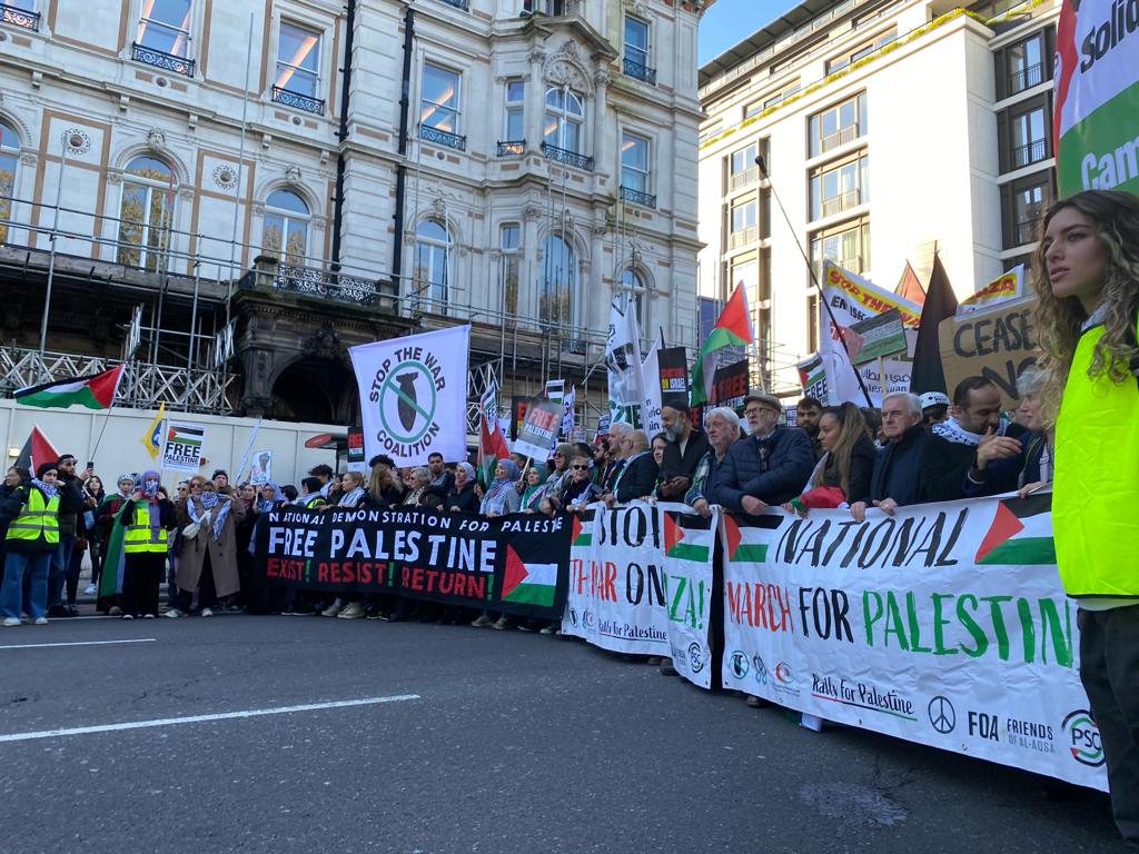 Right at the front of the demonstration stands Adnan Hmidan the man who posted of his "love" for Hamas founder Sheikh Ahmed Yassin. He's standing next to <a href="/UKLabour/">The Labour Party</a> MP <a href="/johnmcdonnellMP/">John McDonnell</a>