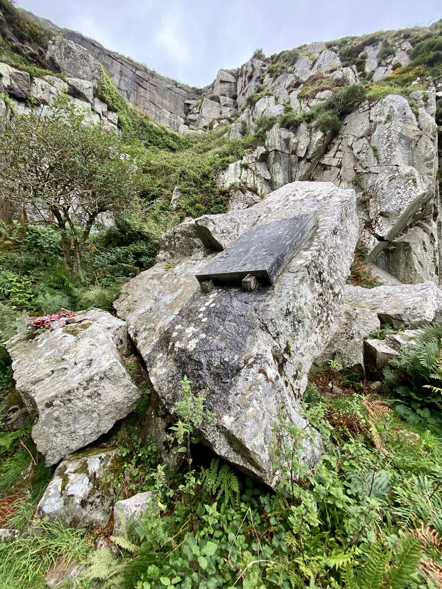 Fixed to a massive fallen slab within V C quarry is an engraved inscription memorial slab dedicated to John Harman. He received a Victoria Cross for his heroism during the Second World War. ‘At the going down of the sun & in the morning we will remember them’.