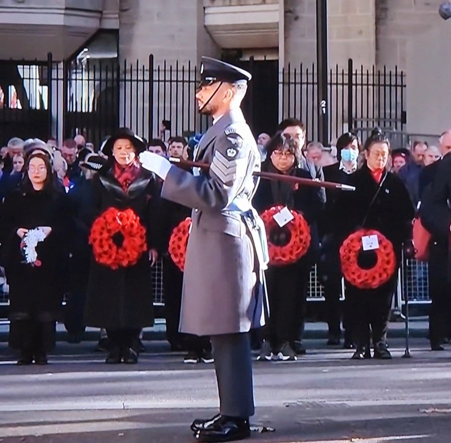 One of my favourite shots of this morning. A Black soldier standing to attention at the #Cenotaph, flanked by Asian women wreath layers, to remember #AllOurFallen... #RemembranceDay