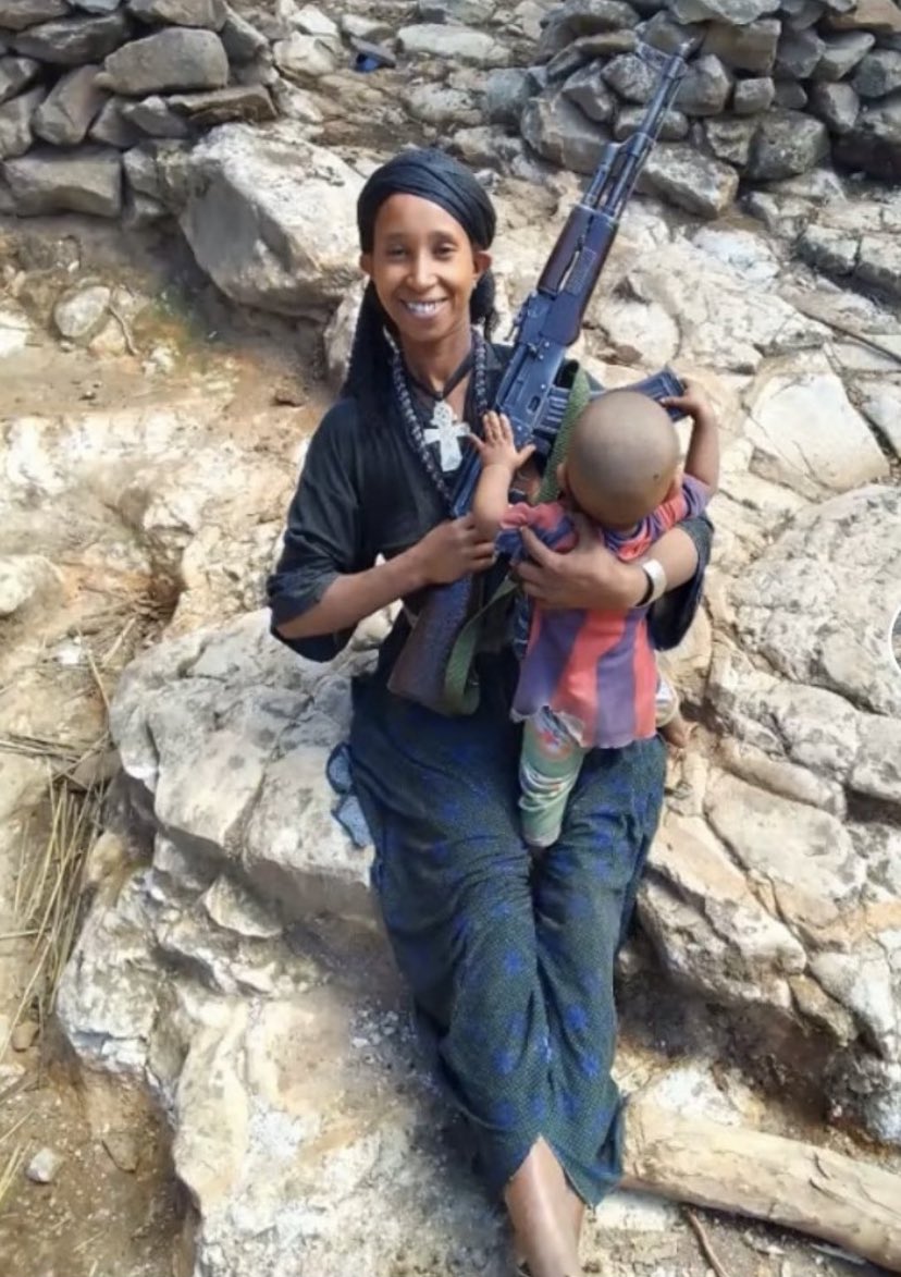 She cares for a baby but she picked up arms because the regime left her with no choice. The courage to carry a child and a gun with this graceful smile makes one speechless.
#FanoCourage 
#WarOnAmhara 
#AmharaUnity 
#AmharaGenocide 
#AmharaRevolution