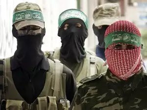 HenMazzig's tweet image. One picture is from Gaza; a proscribed terrorist organization, which burned babies alive and raped little girls, just a few weeks ago. 

The other picture is a “peaceful march” to support this group, in London, today.