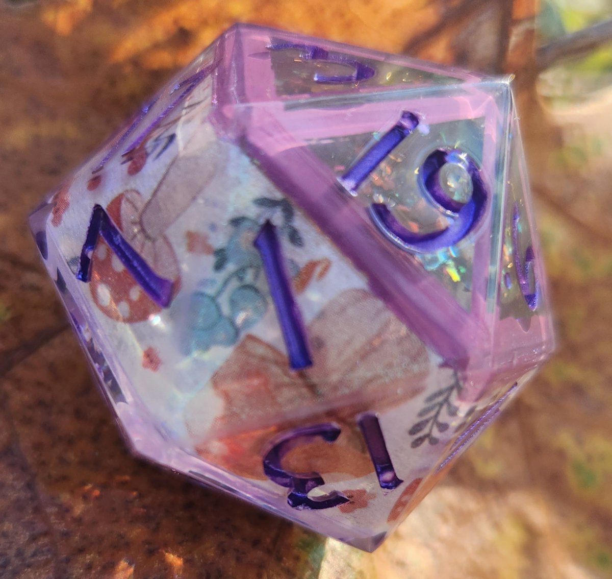 NaevisOddities's tweet photo. 'Flowers &amp; Fairy Circles’ Variant Handmade Shimmery Cottagecore 30mm D20 Dice 👇
This is an oversized 30mm D20 made with custom mold and font exclusive to my shop and my trademarked logo replacing the ... https://t.co/4CDEZy9pXS https://t.co/cIoixhkPPB