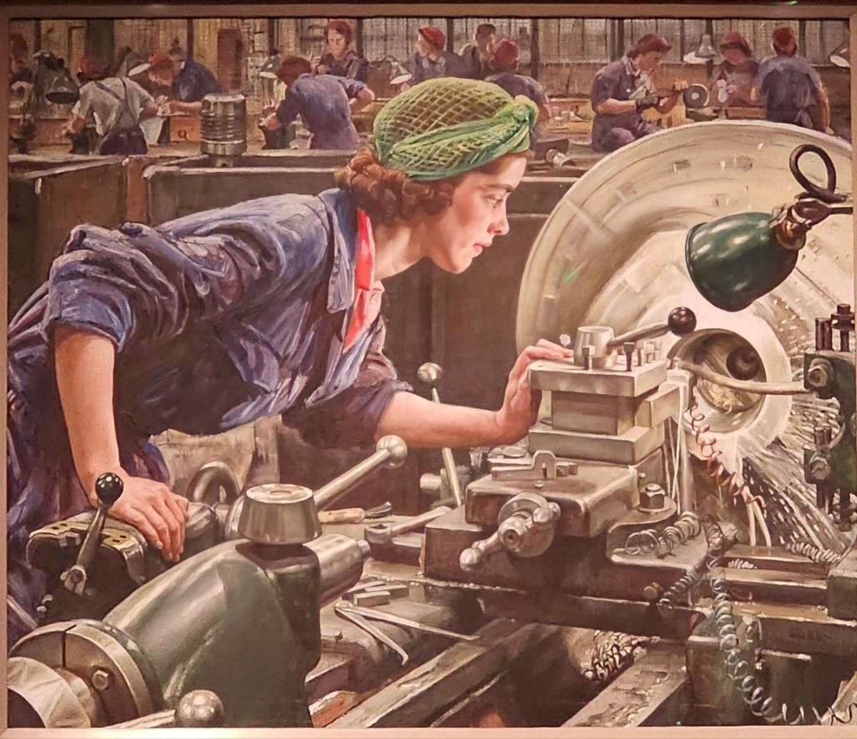 Ruby Loftus working at an industrial lathe cutting the screw of a breech-ring for a Bofors anti-aircraft gun. 
Laura Knight, oil on canvas, 1943.
#chapmanjs #LestWeForget2023 @i_w_m