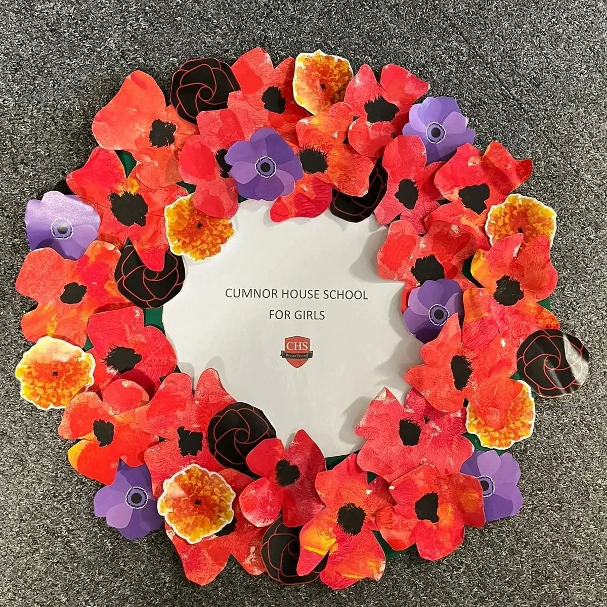 The school wreath that we made, and laid at the  war memororial on Friday for our assembly, incorporated purple poppies, marigolds and blackpoppy roses.  We will remember them - all of them. @CognitaSchools <a href="/WeAreCumnor/">Cumnor House School</a> #RemembranceDay2023