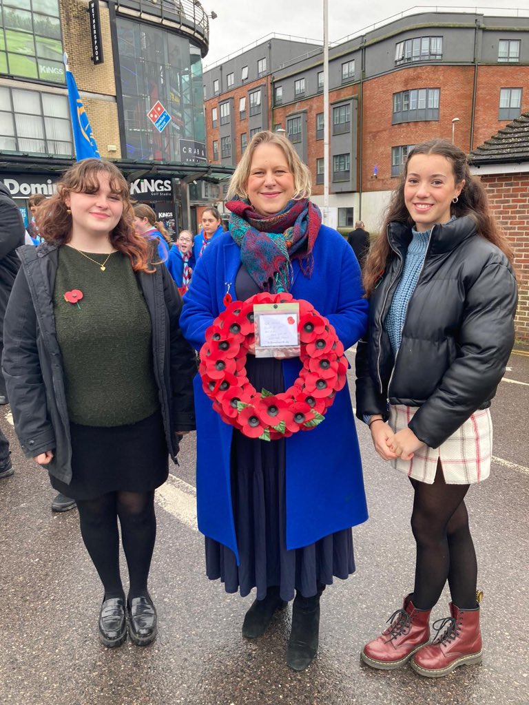 Imberhorne6th's tweet photo. Deputy Headteacher Kitty Marlborough and year 12 students Daisy Tomlin-Walden and Comfort Wallis were proud to represent Imberhorne in the East Grinstead Remembrance Sunday parade today. It was lovely to see so many students, staff and families in the parade and in the crowd. https://t.co/Ha7ooLupZO