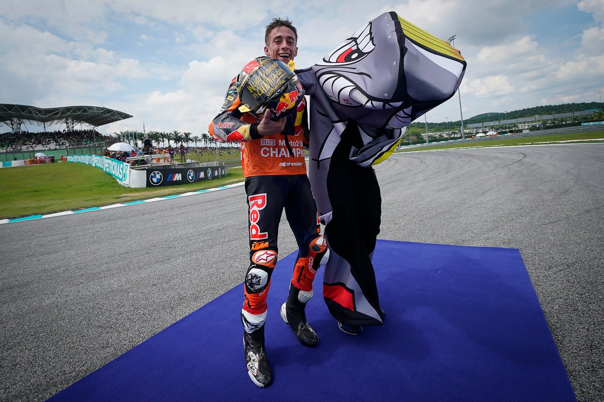 MotoGP's tweet photo. Young but gold! ✨

Yesterday we crowned the first World Champion of the 2023 season and this is how @37_pedroacosta celebrated his #Moto2 title in Sepang! 🏆

#ELT1BURON 🦈 | #MondayMotivation https://t.co/lryMWnWZwB