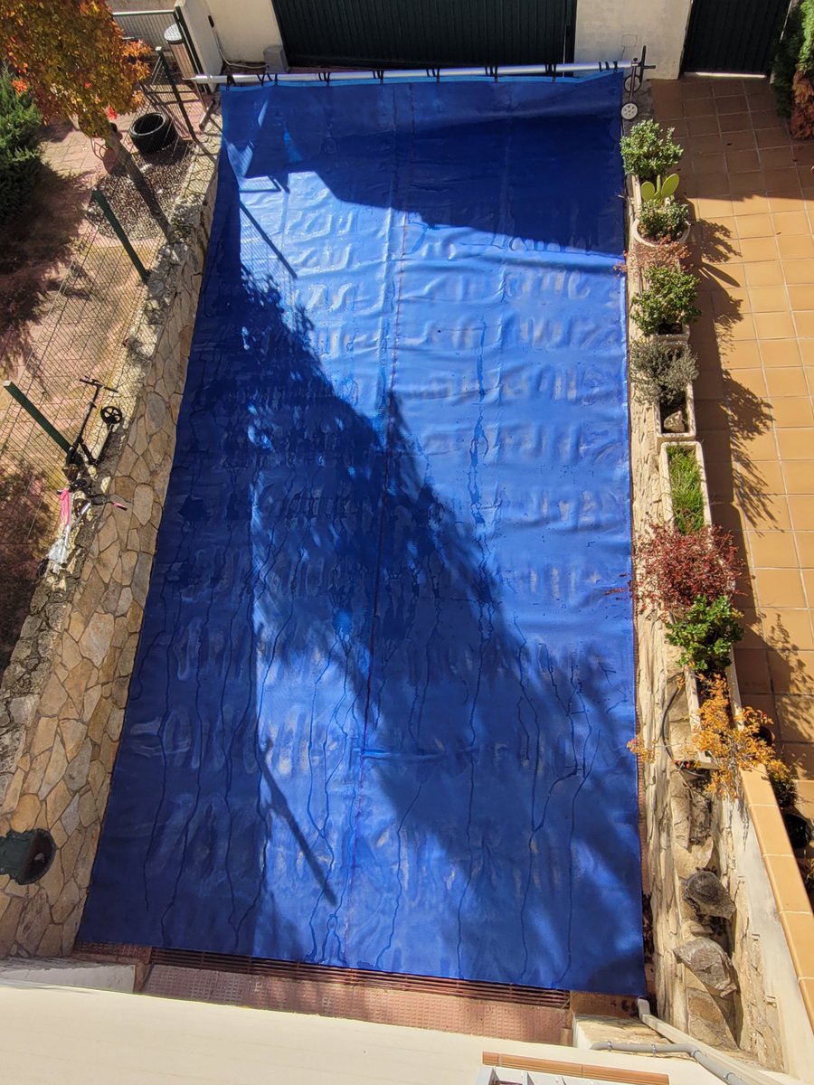 Every year I'm amazed anew at how neatly my solar pool cover fits into the driveway to dry out...