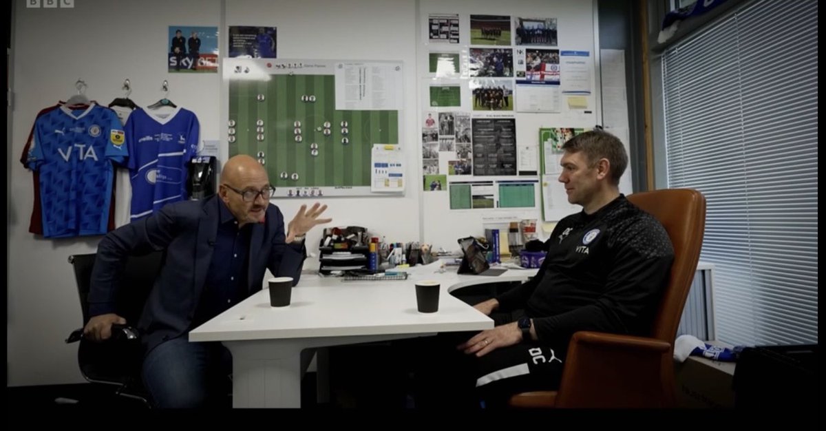 Eagle eyed @AndyTur94183984 spotted George’s flag on DC’s wall during #footballfocus interview by @MarkClemmit 

Of all the months for the interview to happen, it was the one where there is a huge picture of the memorial flag in the gaffers office. 

Nice one George 💙