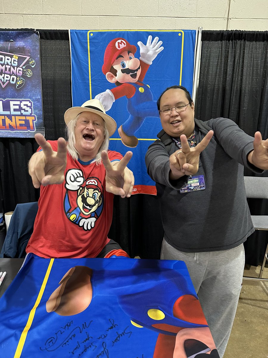 UnicityPoint's tweet image. The 7 foot tall Mario Day banner that I got signed by Charles Martinet is back home and hanging up where it should be 😍