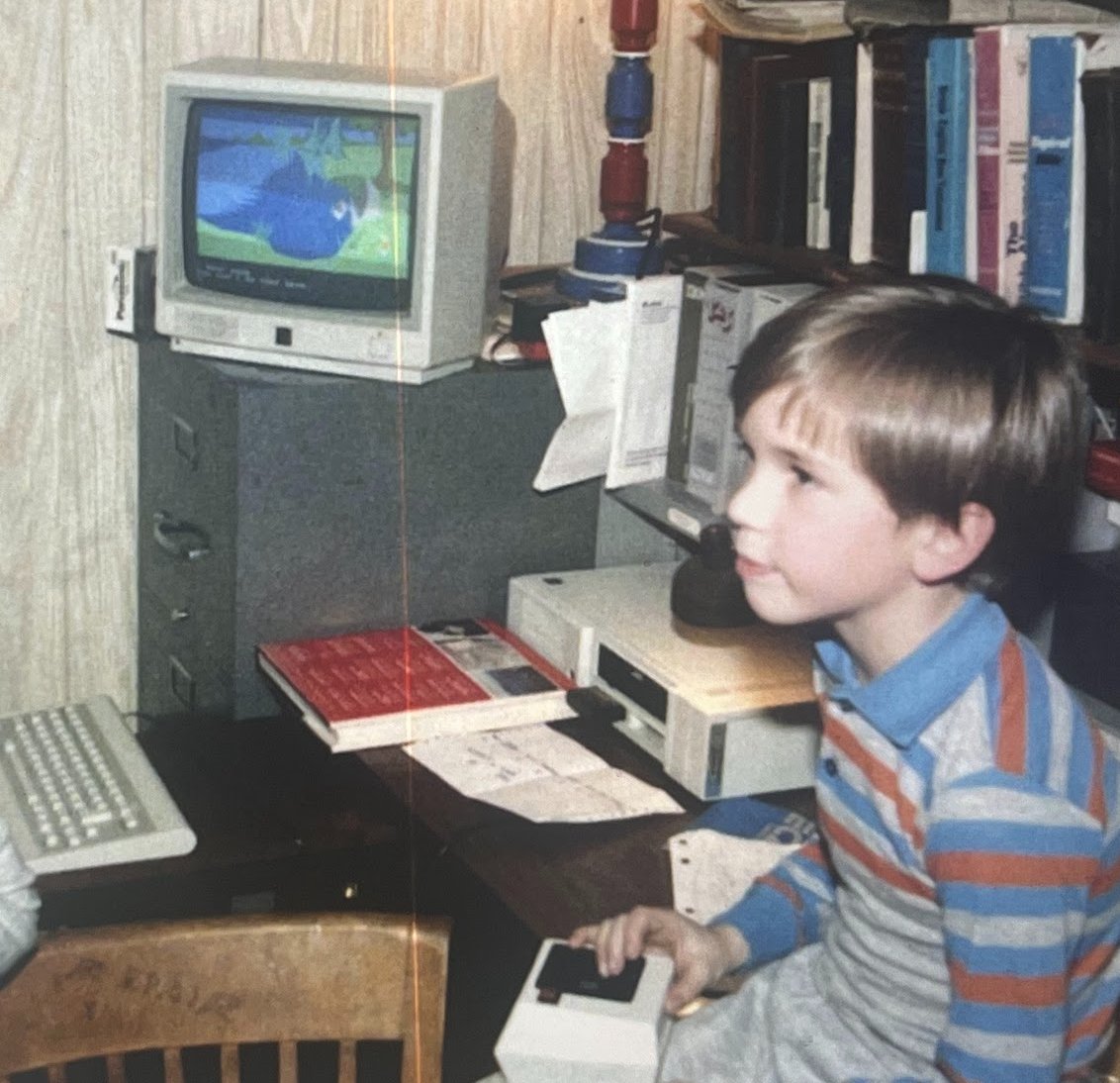 Quote tweet an old photo of you.

I'll throw it back further.  1984, playing Sierra's 'King's Quest' on an old PCjr (8088, 4.77 MHz, 64kb RAM).