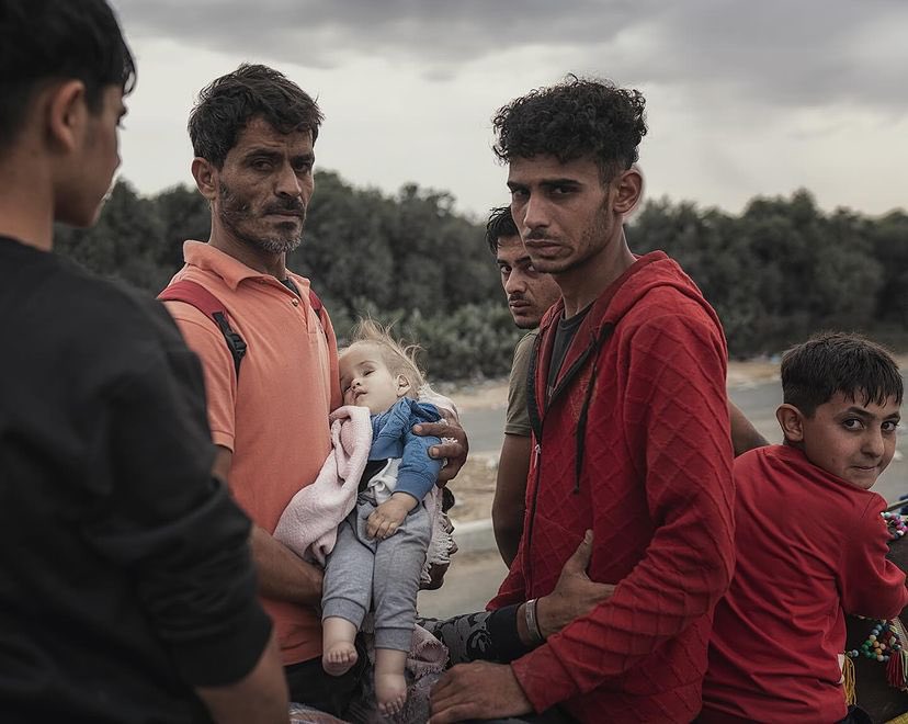 With a desperate look, they lost a lot. 
A Gazan family who flee their house towards the south strip and while crossing the long way on their feet sorrounded by Israeli army they lost their sick baby. 
I was filming them with my phone and didn’t realize that he is dead. 
The man
