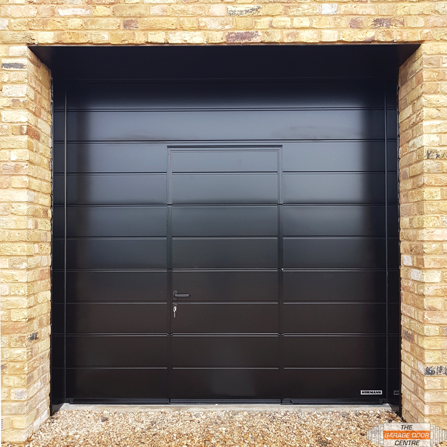 TheGDC's tweet photo. Check out this black sectional garage door featuring a wicket door🖤

This unique installation is the perfect blend of style and utility, making your daily life more convenient and your home more elegant.

📞 01933 229135
📧 enquiries@thegaragedoorcentre.co.uk https://t.co/xHY1h8odho