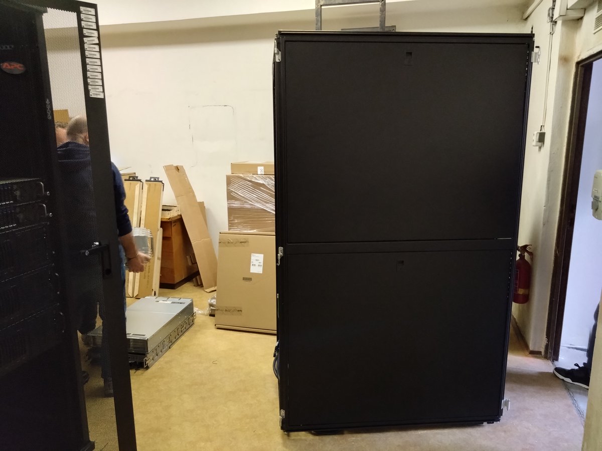 What could be a better team building activity for a group of computational chemists than to move a cluster rack through a small door?
