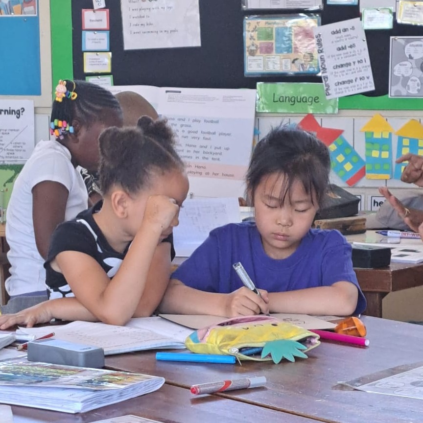 WISNamibia's tweet image. Grade 2 students are collaborating to reinforce their understanding of addition math problems by assisting each other. #mathsisfun #learningatwis #grade2 #primaryschool