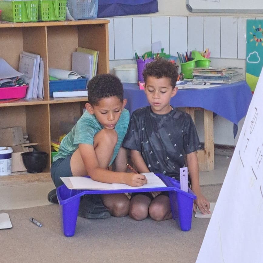 WISNamibia's tweet image. Grade 2 students are collaborating to reinforce their understanding of addition math problems by assisting each other. #mathsisfun #learningatwis #grade2 #primaryschool