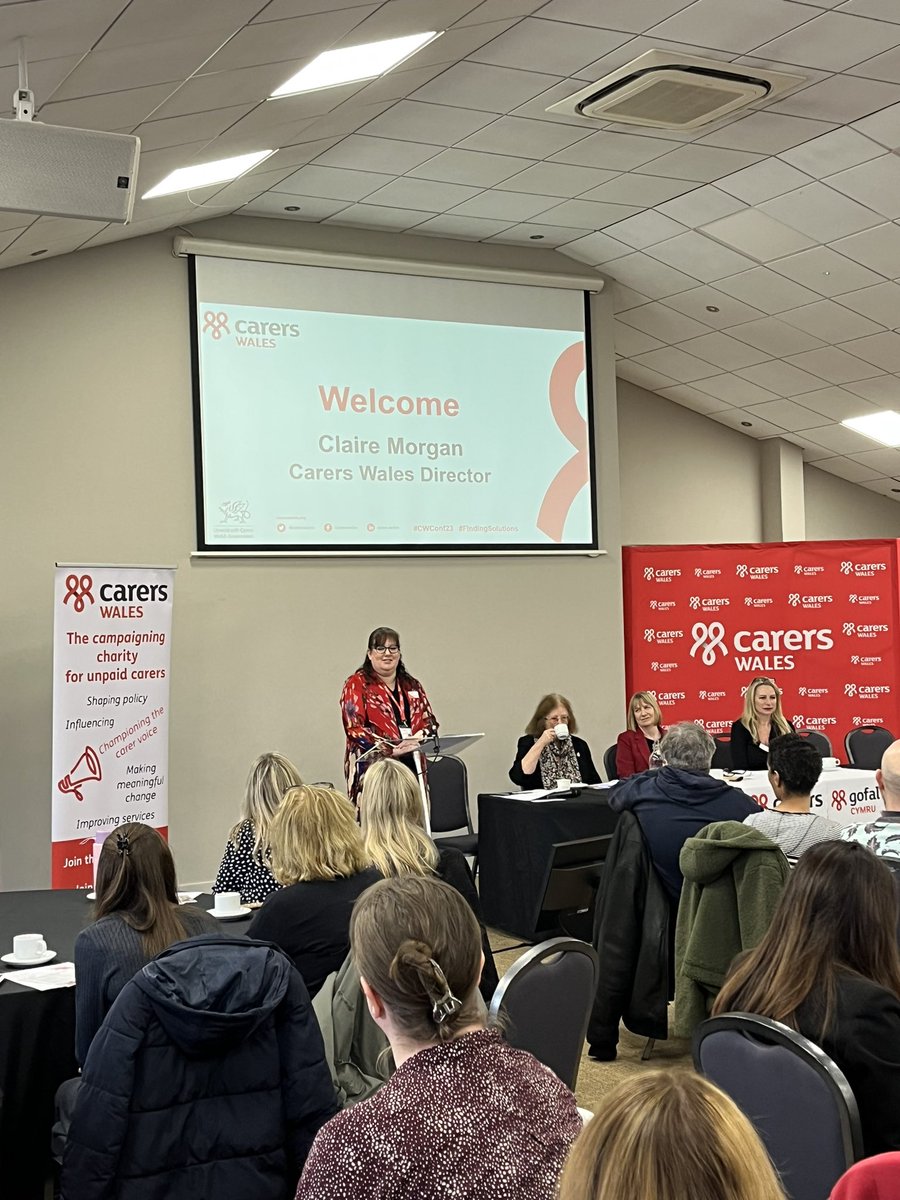 Claire Morgan @CarersWalesDir welcomes online and in-person attendees to the #CWConf23. Organisations across health and social care and unpaid carers have come together with a focus on #FindingSolutions.