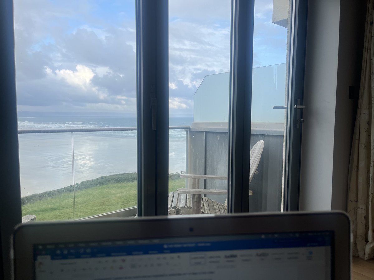 cathgladstone's tweet photo. An early morning writing sprint with a view of the North Devon coast for me this morning. Is anyone else happiest on holiday when they keep writing and read a LOT of books? #writingcommunity #amwriting #amreading https://t.co/Ggi9CYHZxm