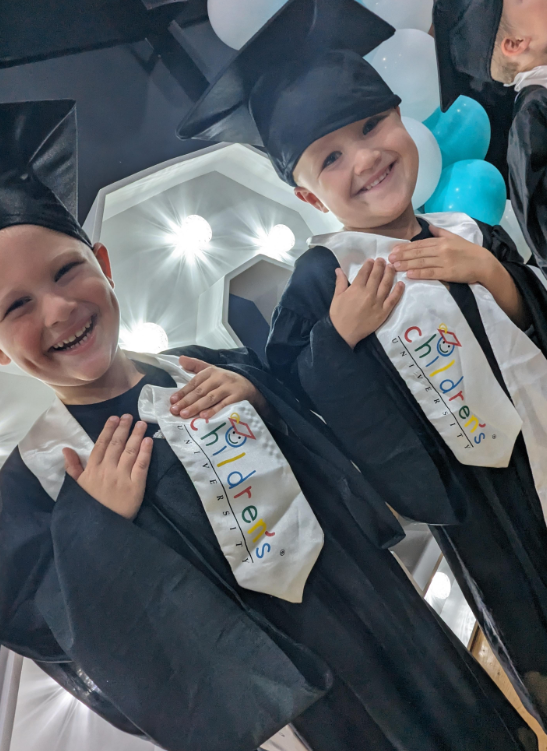 Well done to these two for obtaining their children's university awards!