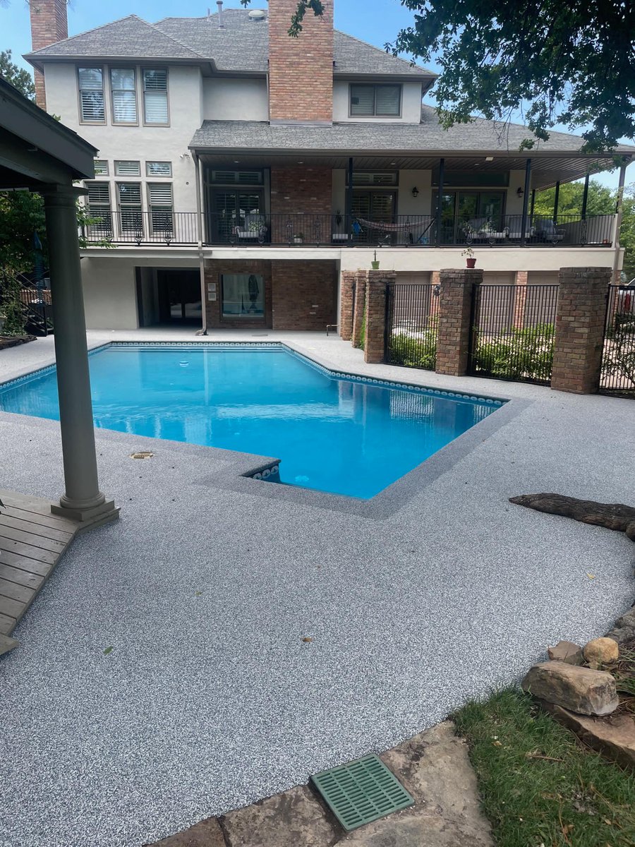 SOFTROC_OKC's tweet photo. This pool deck was one of the worst yet! The customer wanted to avoid the concrete tear-out and additional damage to the pool. Softroc of OKC came in and sprinkled a little magic fairy dust and made this outdoor space functional again. #Softroc #rubbersurfacing #niptheslip https://t.co/iZTlqDJO1v