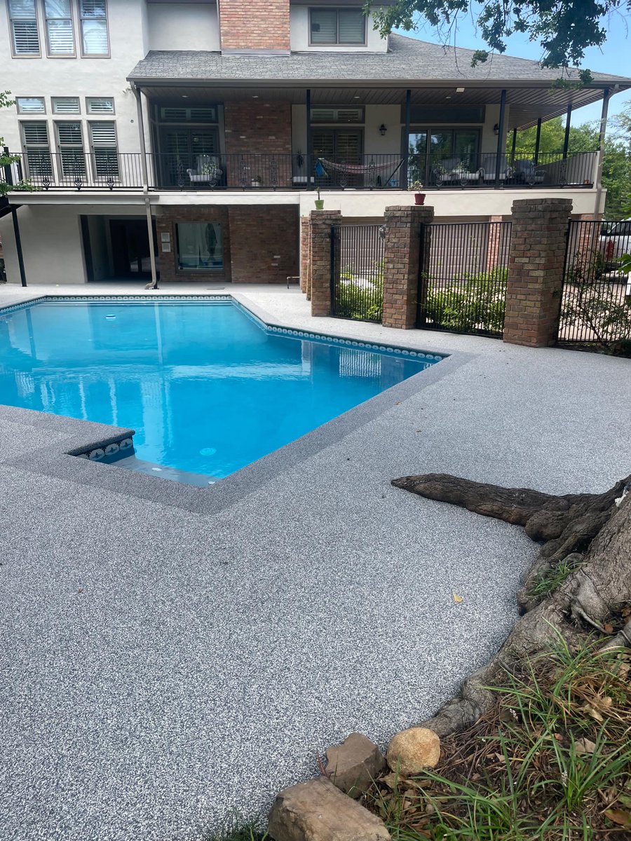 SOFTROC_OKC's tweet photo. This pool deck was one of the worst yet! The customer wanted to avoid the concrete tear-out and additional damage to the pool. Softroc of OKC came in and sprinkled a little magic fairy dust and made this outdoor space functional again. #Softroc #rubbersurfacing #niptheslip https://t.co/iZTlqDJO1v