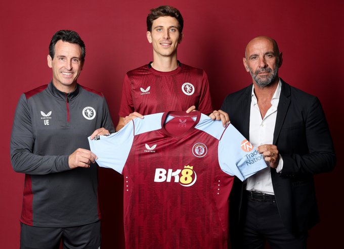 Unai Emery, Pau Torres and Monchi holding the 2023/24 Aston Villa home shirt during a photoshoot at Bodymoor Heath.