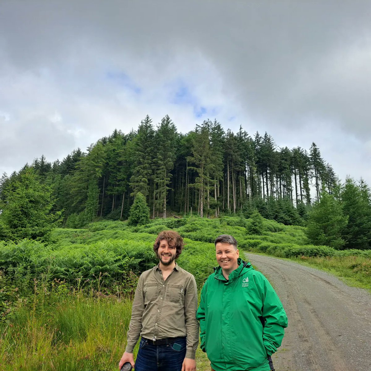 GrizedaleSculpt's tweet photo. Rachael our Forest Planner and architure student Tom exploring the historic industries of the forest yesterday from charcoal burning to iron smelting. #grizedaleforest #forestartworks #woodlandheritage @VisitGrizedale @CSMArchitecture https://t.co/PvtIQJWx0g