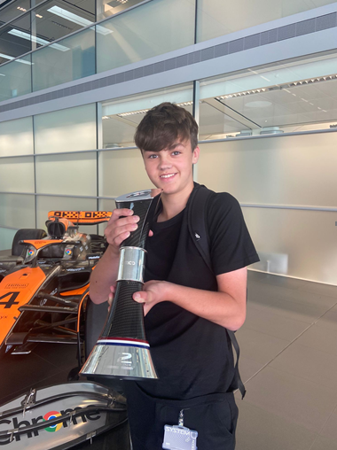 One or our Y10s is on work experience at McLaren  and is holding Lando Norris' 2nd place trophy won at Silverstone F1 GP last weekend.  We think he is probably enjoying his work experience week!