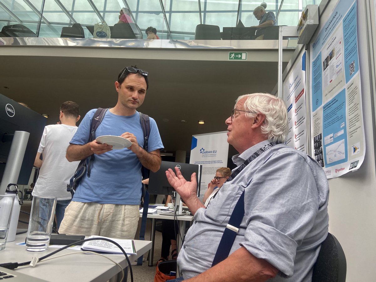 dfiser3's tweet photo. We're honored that the fabulous Steven Krauwer, first executive director of @CLARINERIC, is sharing his expertise and enthusiasm with #dh scholars attending @DH2023Graz this week! #InfoDesk #CLARINResourceFamilies https://t.co/22rGWQA0Pp
