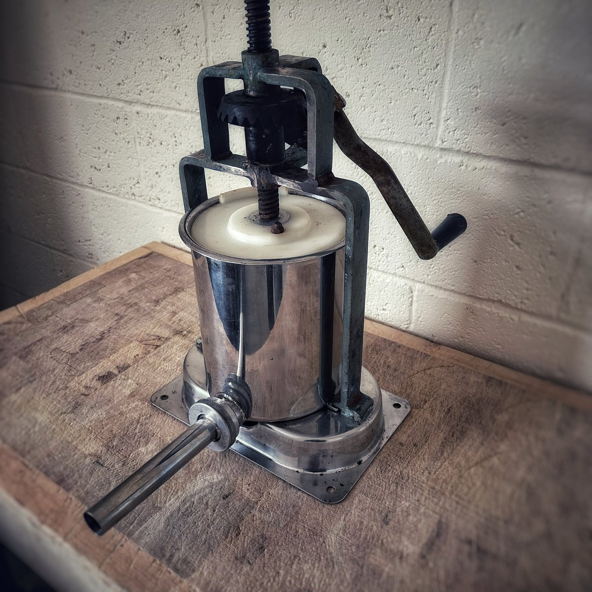 fruitpigcompany's tweet photo. A touch of nostalgia here. Found our first ‘stuffer’ hidden away. This beast was capable of a whole 5kg of mix in…in a period of arm-winding time. Contrast that with our 250kg Risco/TipperTie system which is a little faster. #blackpudding #haggis #whitepudding #hogspudding https://t.co/9abPFlB4qM