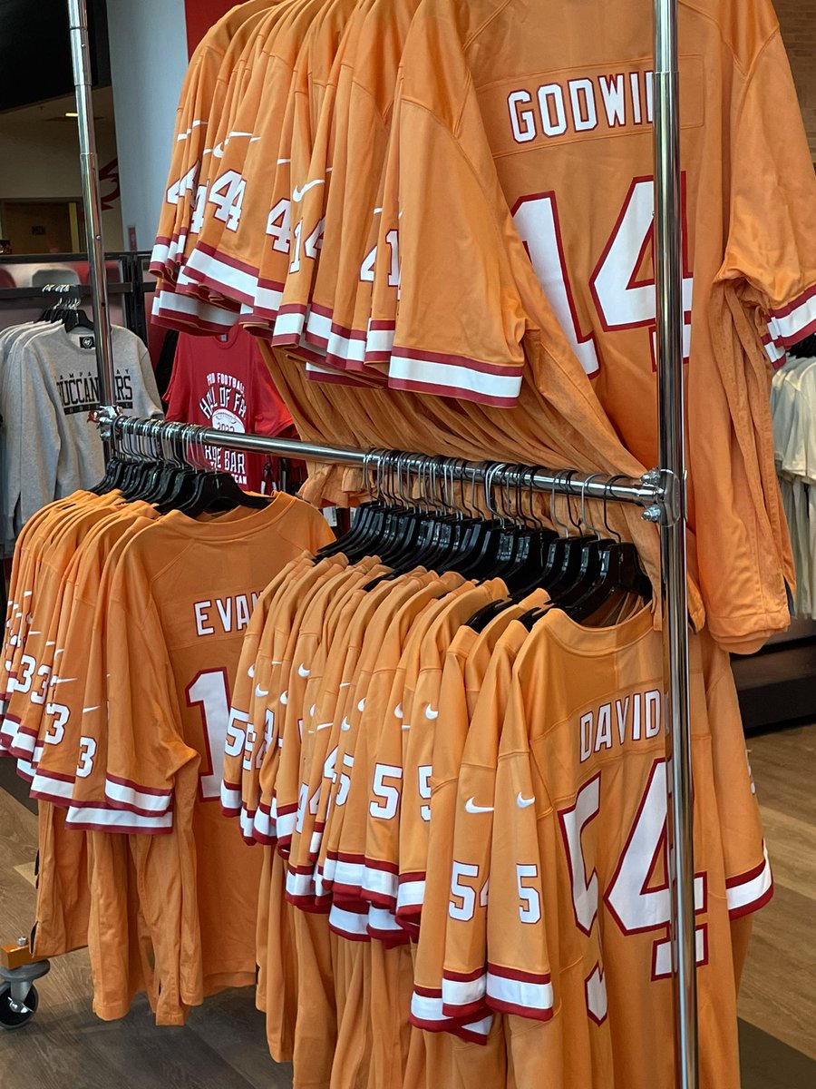 gregauman's tweet photo. Here’s first look at Bucs’ throwback orange Creamsicle jerseys in team store — they’re selling Brady, Evans, Godwin, White and David. They’ll wear them on Oct. 15 vs. Lions. https://t.co/AqkK22BWoI