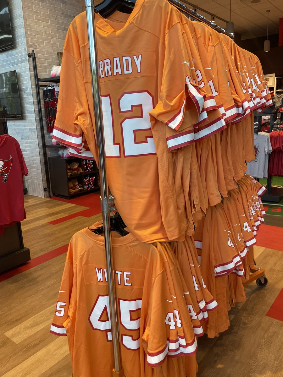 gregauman's tweet photo. Here’s first look at Bucs’ throwback orange Creamsicle jerseys in team store — they’re selling Brady, Evans, Godwin, White and David. They’ll wear them on Oct. 15 vs. Lions. https://t.co/AqkK22BWoI