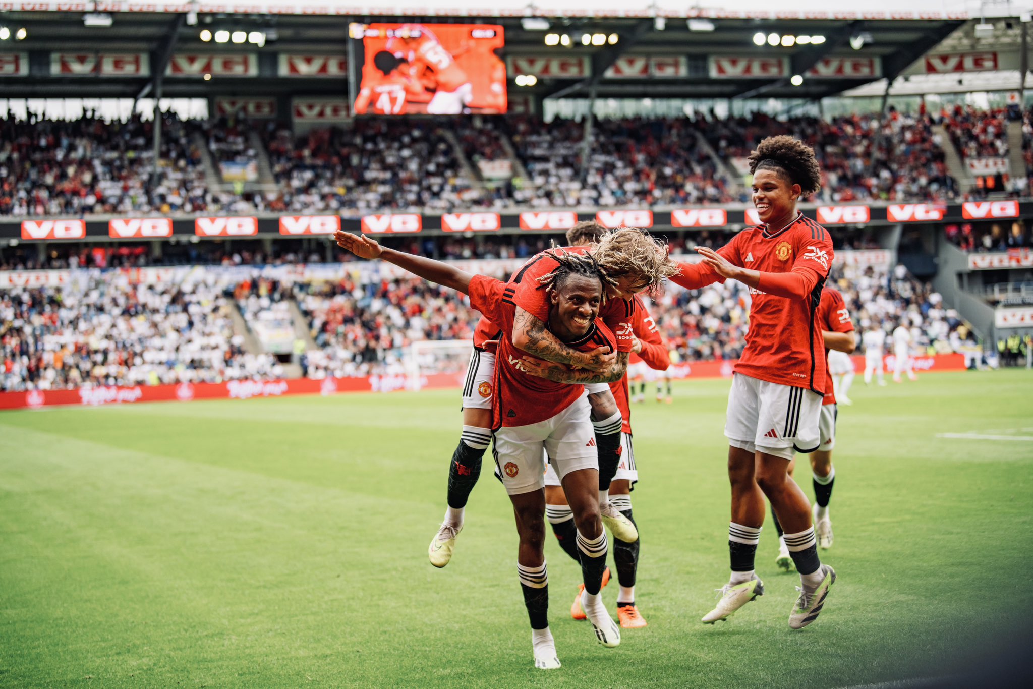 Noam Emeran celebrates his goal v Leeds with his United team-mates.