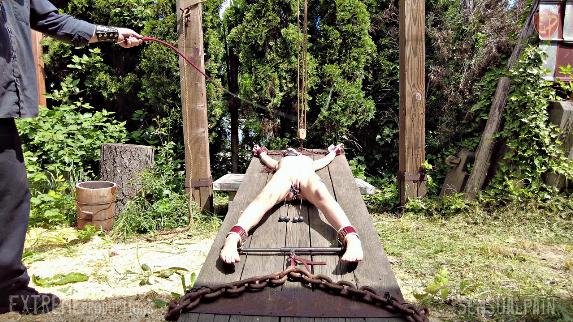 Female Slave Whipped On Rack - The slave is outside, stretched out on the wooden rack under the hot sun for whipping and genital torture.

Sensualpain.com/Media.php?ID=F…